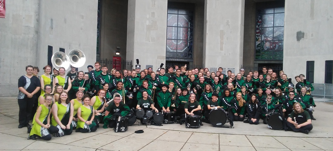 Marching band and colorguard posing in front of the Buckeye Invitional at Ohio Stadium